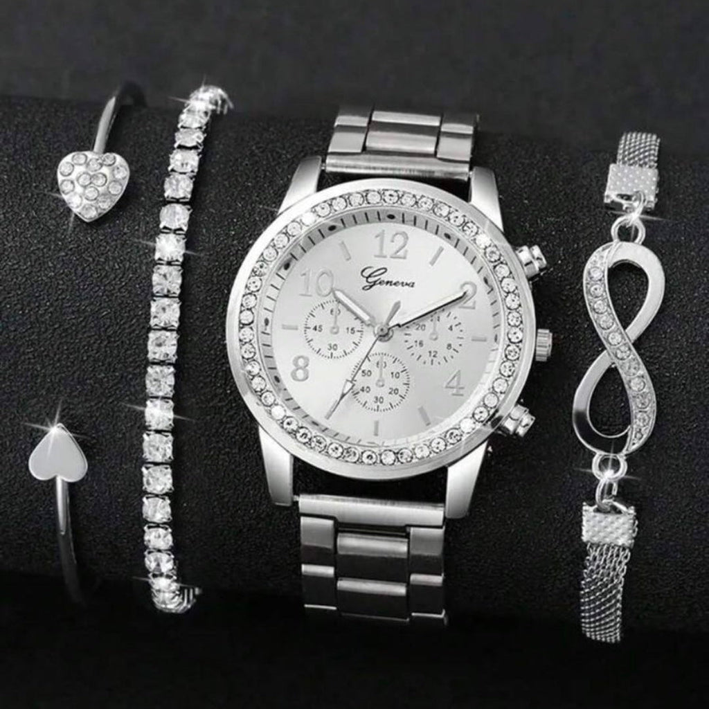 Silver watch and jewelry set on a black background