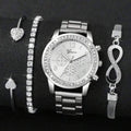 Silver watch and jewelry set on a black background