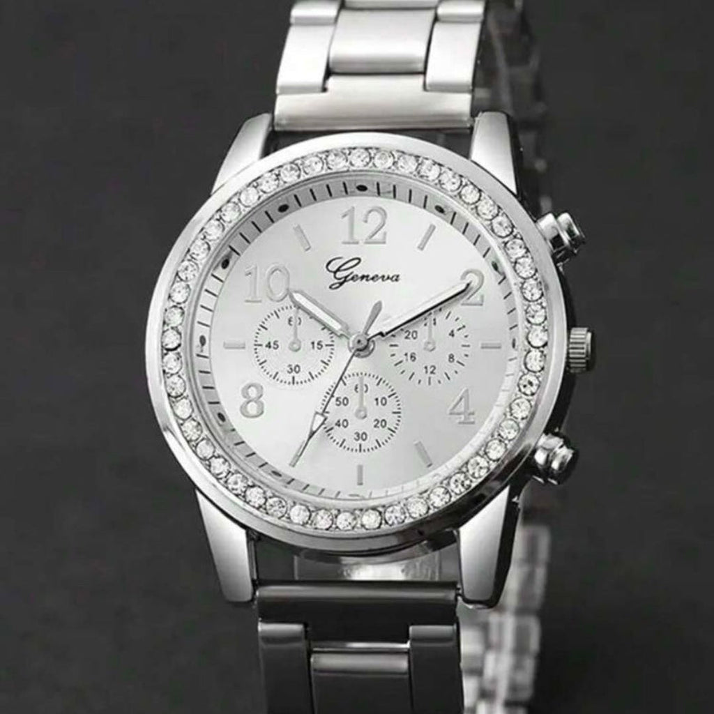 Silver wristwatch with gemstone accents on a dark background