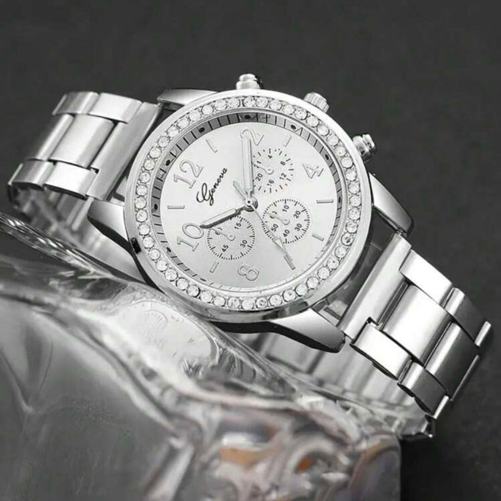 Silver wristwatch with detailed face on a dark background