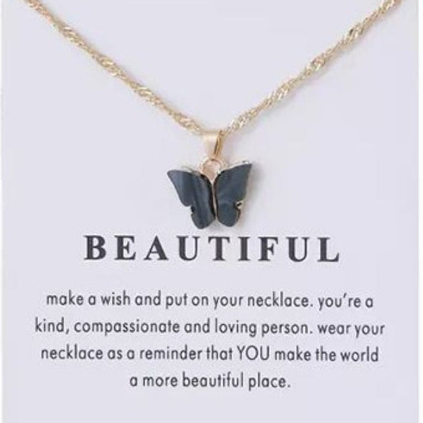 Butterfly necklace on a card with text