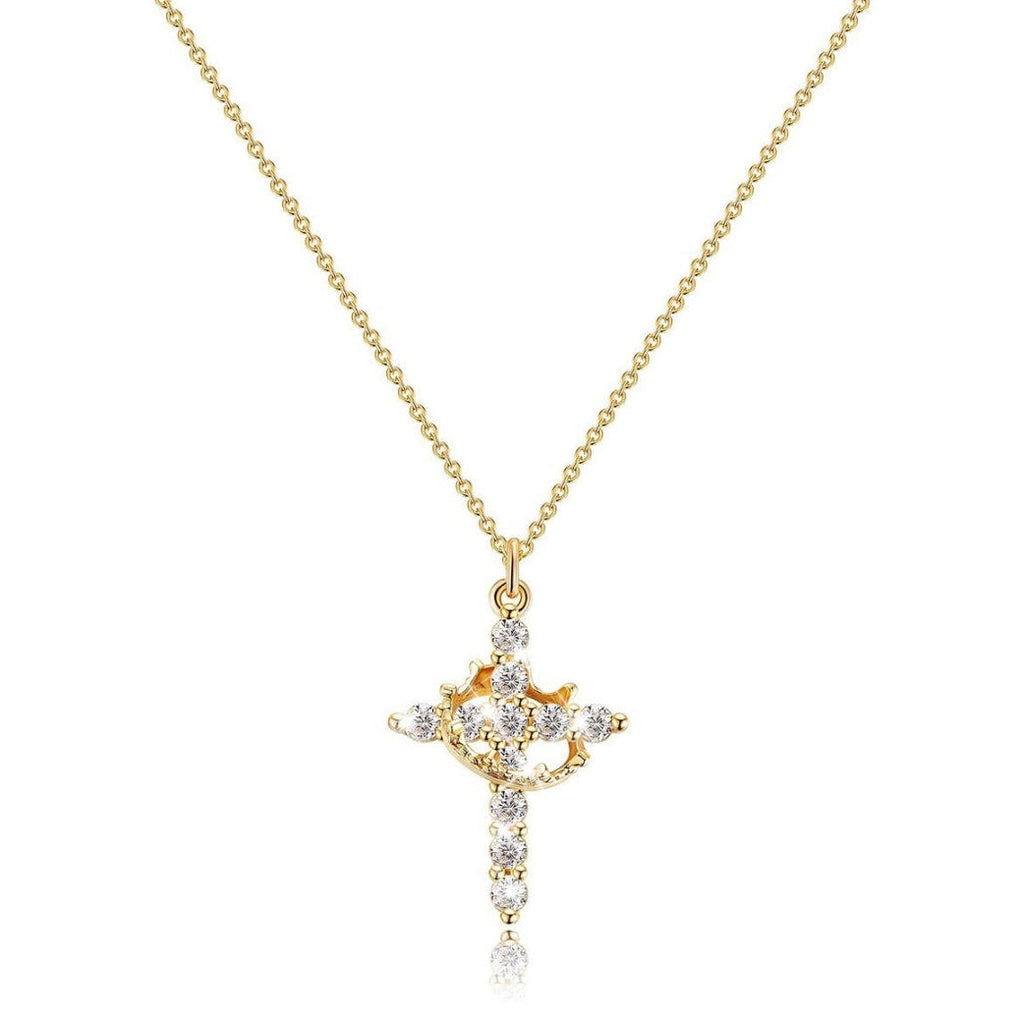 Gold cross pendant necklace with diamonds on a white background
