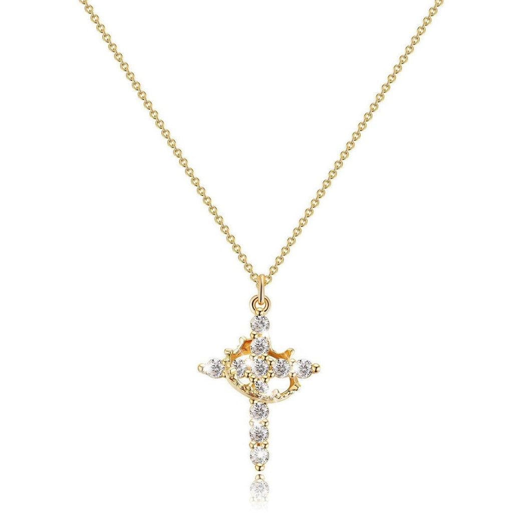 Gold cross pendant necklace with diamonds on a white background