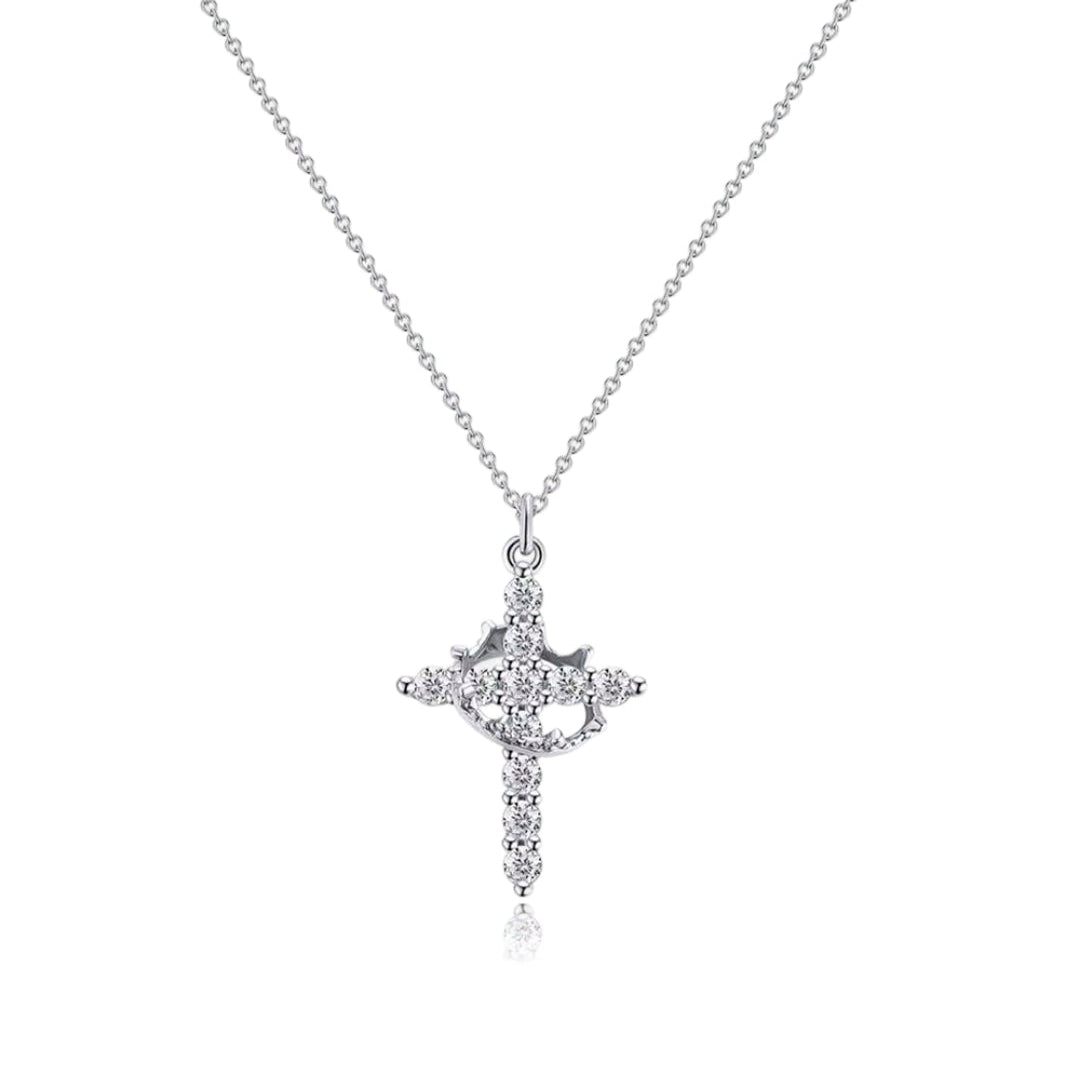 Silver cross pendant necklace on a white background
