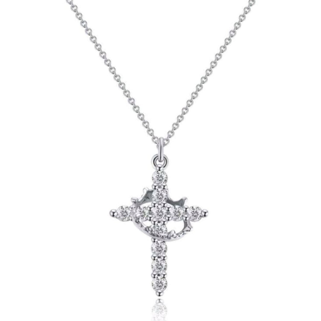 Silver necklace with a cross pendant on a white background