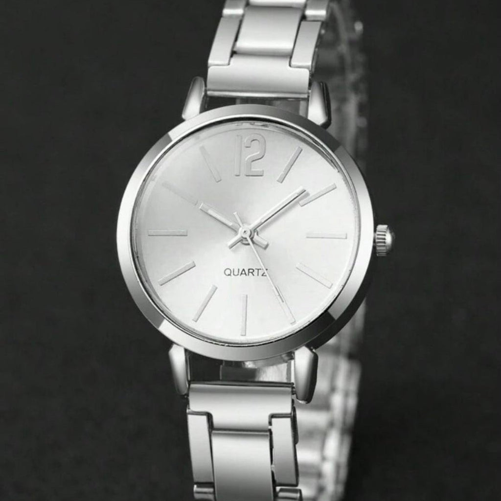 Silver wristwatch with a dark background